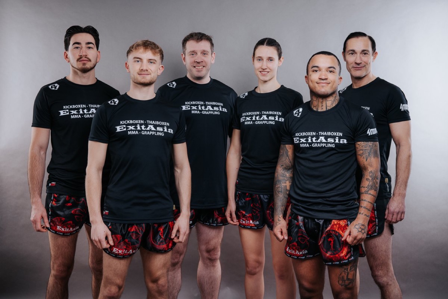 the hey coach / exitasia team — six trainers together in the studio